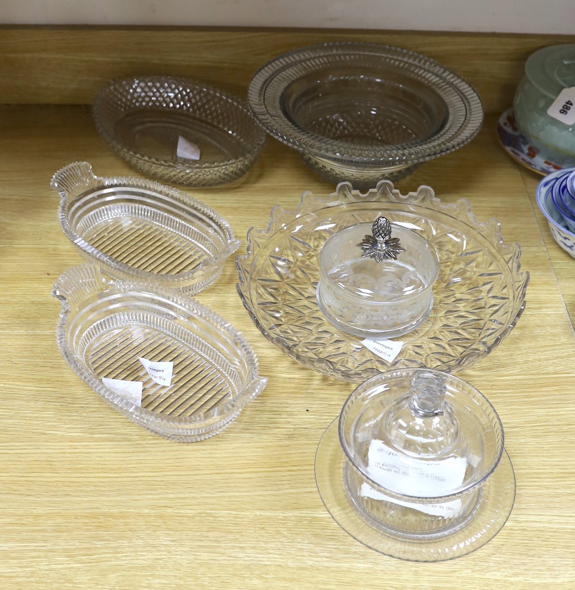 A selection of various late Georgian cut glass dishes, and a later silver mounted pineapple lidded pot and others